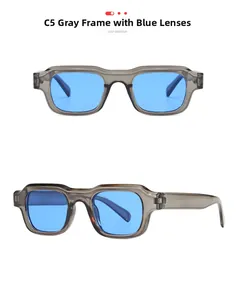 Macro detail of retro square gray frame sunglasses with vibrant blue lenses for women