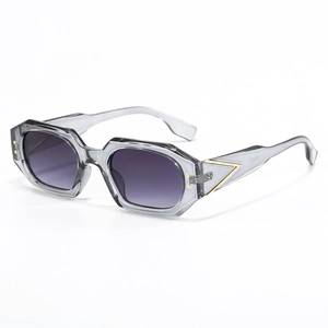 Polygon sunglasses with transparent grey frames and purple gradient lenses for women