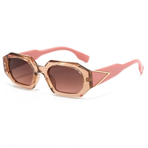 Modern polygonal sunglasses with amber frames, pink temples and golden triangle accents