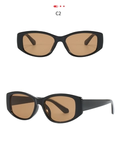 Detail view of cat-eye square sunglasses featuring thick black frames and brown lenses