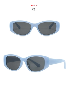 Vertical view of retro square cat-eye sunglasses in translucent light blue with gray lenses