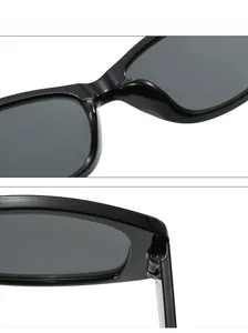Close-up of integrated nose pads and durable metal hinges on black vintage sunglasses