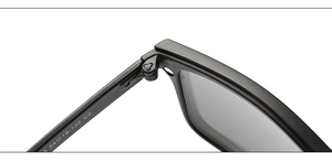 Macro detail of matte black TR90 frames showing hinges and size specs 54-18-138