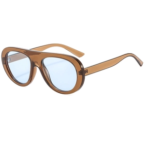 Fashion pilot sunglasses with amber frames and light blue lenses in a modern oversized style
