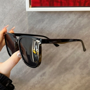 Classic black oversized square sunglasses with silver metal studs on glossy frame