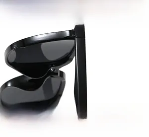 Detail view of the sturdy metal hinge and textured black temples of these sun glasses