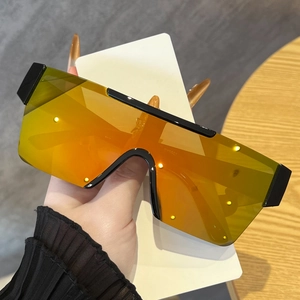 Détail de lunettes de soleil tendance sans monture avec verres miroir orange et marquage GY5601