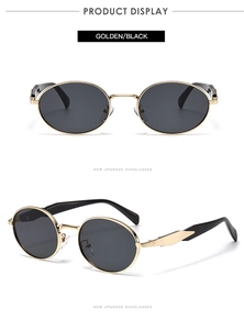 Détail des lunettes de soleil ovales en métal doré et noir avec montures fines