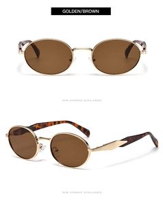 Vue détaillée de lunettes de soleil ovales en métal doré avec verres bruns et branches