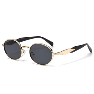 Lunettes de soleil ovales rétro avec monture dorée et verres foncés style vintage