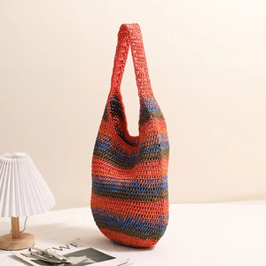 Striped woven straw shoulder bag with colorful crochet pattern for beach vacations