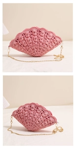Macro detail of a pink shell-shaped straw bag with gold chain strap and woven texture