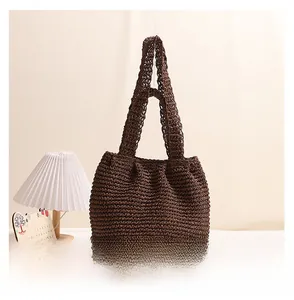 Detail view of the large capacity coffee brown woven cotton rope tote bag back side
