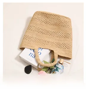 Top view showing the large interior capacity of the hollow crochet raffia straw beach bag
