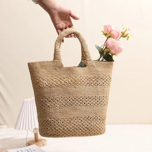Hollow out raffia woven handbag in natural beige for beach vacation and summer travel