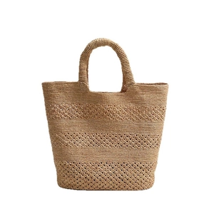 Handwoven raffia tote bag with hollow wave patterns for summer beach vacations