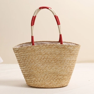Handmade straw tote bag with cherry embroidery and red-white contrast handles for beach