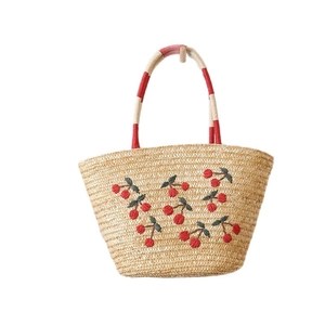 Handwoven straw tote bag with cherry embroidery and colorful handles for beach vacation