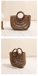 Detail of hollow half-moon woven straw bag with contrast color and circular handles