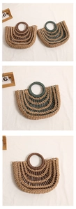 Close-up of hollow semi-circle straw bags with round handles in brown and green