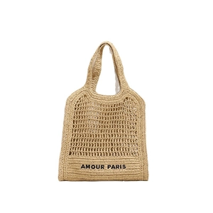 Large beige woven straw tote bag with Amour Paris embroidery for summer beach vacation