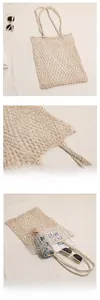Detail showing the large capacity of the hollow mesh woven beach bag with sunglasses
