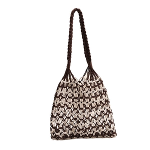 Two-tone woven cotton mesh shoulder bag in brown and cream for summer beach vacation