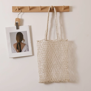 Handwoven cream hollow mesh tote bag for summer beach vacation and casual shoulder use