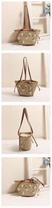 Detail of floral daisy embroidery on woven straw tote with slim brown leather strap