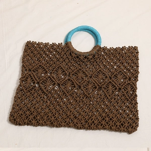 Square hollow straw handbag with blue round handles for summer beach vacation style