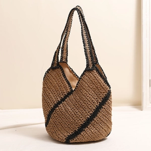 Large woven straw shoulder bag with geometric black stripes for beach vacations and holidays