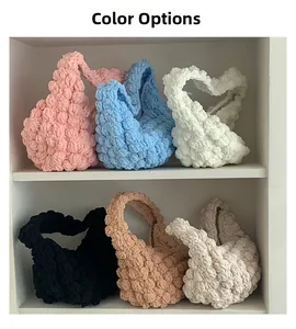 Color options of hand-woven straw bags in pink, blue, white, black, camel, and cream