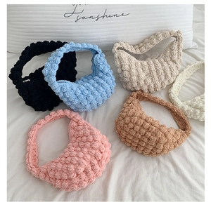 Macro detail of handmade crochet tote bags with 3D bubble texture in multiple colors