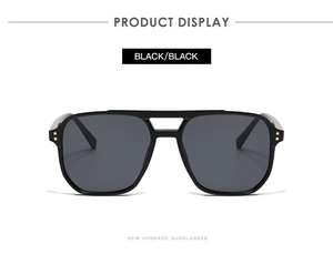 Détail de lunettes aviateur noires avec rivets métalliques et branches modernes