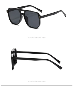 Vues détaillées des lunettes pilote noires avec rivets dorés et verres gris foncé