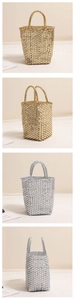 Close-up of metallic woven tote bags in gold and silver for summer beach vacation