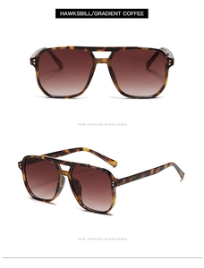 Détail de lunettes aviateur à monture écaille, verres dégradés marron et rivets