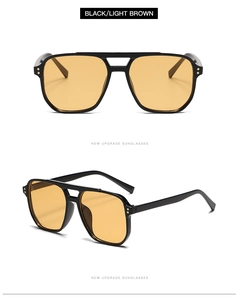 Détail de lunettes aviateur avec double pont et verres gelée marron clair de style rétro