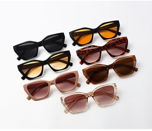 Detailed flat lay of cat-eye sunglasses collection with various frame colors and lens tints