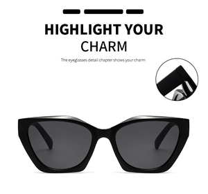 Detail view of black cat eye sunglasses featuring thick frames and metal hinges
