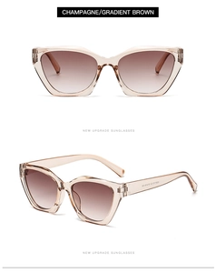 Detail of cat-eye sunglasses with champagne frames and brown gradient lenses