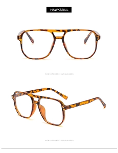 Détail de lunettes aviateur écaille de tortue avec double pont et rivets dorés