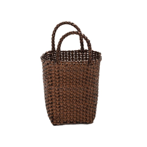 Brown woven basket tote bag with sturdy handles and a minimalist rustic design