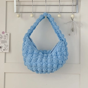 Sky blue chunky knit handmade straw-style handbag with soft bubble texture and top handle