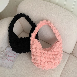 Handmade crochet popcorn stitch handbags in black and pink for beach vacation