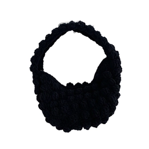 Handmade black popcorn stitch crochet handbag for beach vacation and summer style