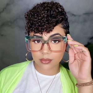 Close-up of stylish oversized square glasses with green and pink gradient frames on model