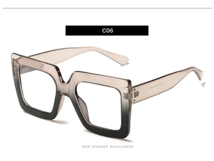 Detail view of square blue light glasses featuring a coffee to black gradient frame