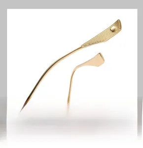 Detail of ergonomic curved golden metal temples with decorative engraving on sunglasses