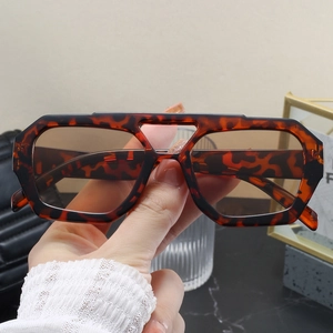 Close-up of tortoise shell aviator sunglasses with a double bridge and tea lenses